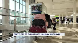 Holiday rush: Travelers head to LaGuardia Airport during expected record-breaking end of the year travel