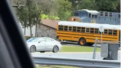 School bus driver arrested after driving bus onto train tracks
