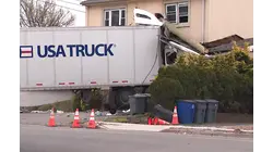 Driver rescued after tractortrailer crashes into Clifton building