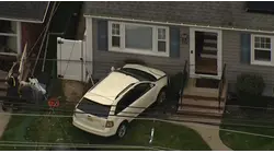 SUV crashes into Linden home after collision; other driver flees scene