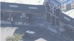 2 people found dead inside Redwood City liquor store after building caught fire, authorities say