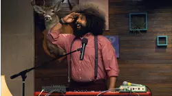 Zach Galifianakis Wears a Blue Jacket & Red Socks