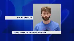 Mineola man arrested for throwing chemical mixture that ignited into an apartment hallway fire
