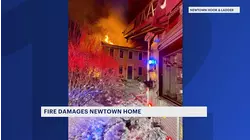 Crews battle freezing temperatures during fire in Newtown