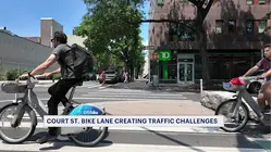 Court Street bike lane create challenges for some businesses and neighbors