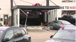 Driver crashes through Medford car dealership to steal another vehicle