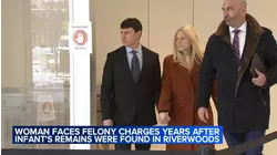 Woman in court, charged years after infant remains found in suburbs
