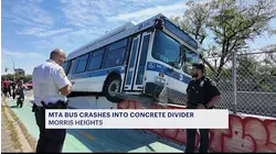 MTA bus collides with concrete divider in Morris Heights