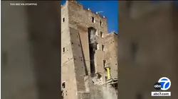 Worker trapped for 11 hours after collapse of medieval tower in central Rome dies