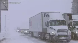 Storms on both coasts threaten holiday travel