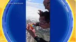 Man solves Rubik's Cubes while skydiving