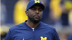 Former Michigan coach charged with home invasion, stalking