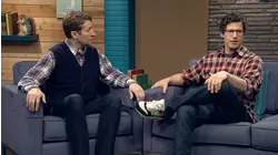 Ed Helms Wears a Grey Shirt & Brown Boots