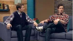 Ed Helms Wears a Grey Shirt & Brown Boots