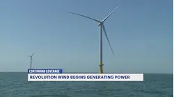 Officials celebrate the start of electrical production at Revolution Wind