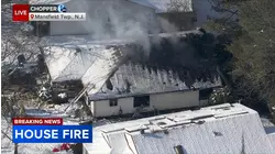 Crews battling house fire in Burlington County