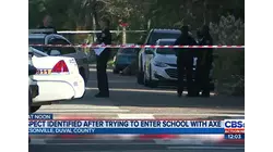 Man shows up to a school with an ax