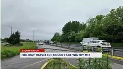 Snowy rain mix as record holiday travel gets underway