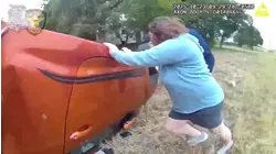 Police Bodycam Video Shows Baby Rescued From Overturned Car