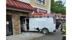 Surveillance video shows van crash into Monroe insurance office