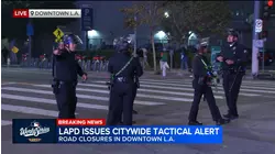 Police issue dispersal order in downtown LA as Dodger fans take to the streets to celebrate