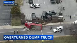 Dump truck overturns after crash on West Chester Pike in Upper Darby