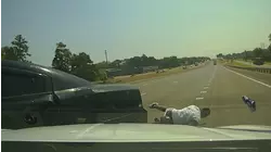 Officer Clings to Getaway Car
