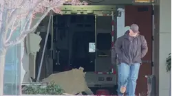 Suspect at large after stolen ambulance rammed into DHS offices building: Authorities