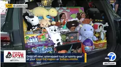 Subaru brings cars stuffed with donations to Spark of Love toy drive