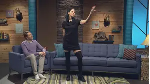 David Cross Wears a Red Polo Shirt and Brown Shoes with Red Laces