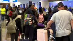 Frustrated travelers scramble after major delays, 1,000+ flights canceled