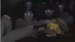 Seth Rogen Wears a Plaid Shirt & Brown Pants