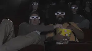 Seth Rogen Wears a Plaid Shirt & Brown Pants