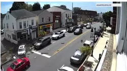 Video: Pedestrian narrowly avoids car crash in Garfield