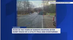 Dump truck hits pole and overturns on Ramapo road