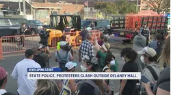 NJ State Police and protestors clash outside Delaney Hall