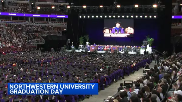 Several NU graduates walk out of United Center during commencement ...