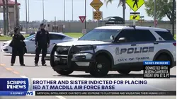 Brother and sister are charged after an explosive device was found outside a Florida Air Force base