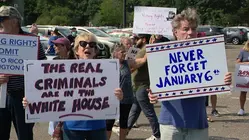 Protesters rally against President Trump's visit to Nassau County