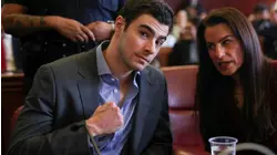 Officer says she missed gun and silencer in Mangione's backpack