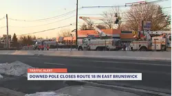 Section of Highway 18 closed in East Brunswick after crash takes down pole, wires
