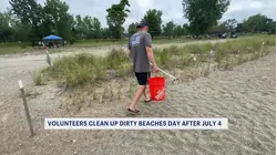 'Dirtiest beach day of the year.' Volunteers clean up beach in Westport after July 4 celebrations leave garbage and debris