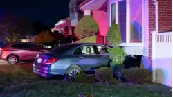 Driver injured after car crashes into Plainview home