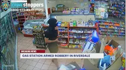 Police search for man behind gunpoint robbery inside Riverdale gas station