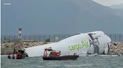 2 dead after cargo plane skids off Hong Kong runway