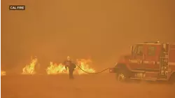 Firefighters battle flames in California as heatwave scorches West