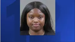 Woman accused of biting, kicking and spitting at officers in Wayne