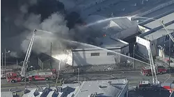 Massive fire breaks out at Boyle Heights commercial building, sending up plume of black smoke