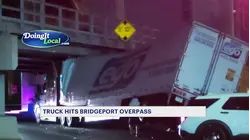 Tractortrailer strikes low overpass in Bridgeport, gets wedged underneath