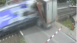 Video shows train in Poland slam into big rig stuck on tracks